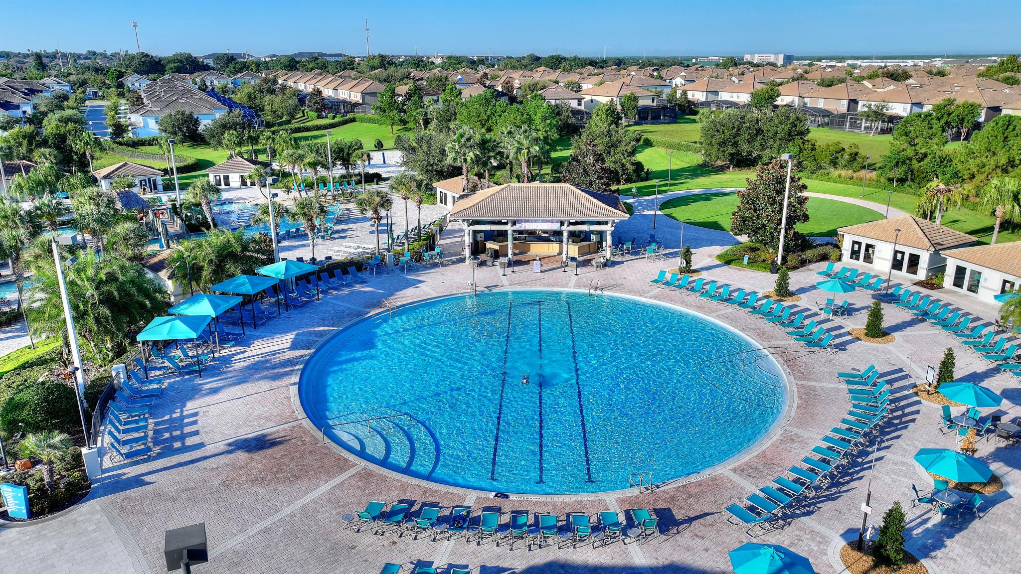 Aerial view of the round heated pool and poolside bar at the Oasis Club